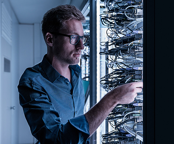  Man working at the server racks