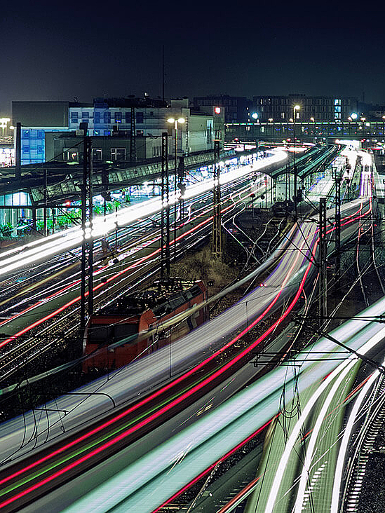 Illuminated railroad track network at night